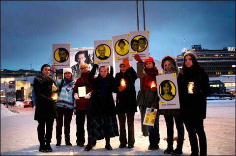 Активисты Финляндии провели акцию с зажженными свечами и портретами политзаключенных